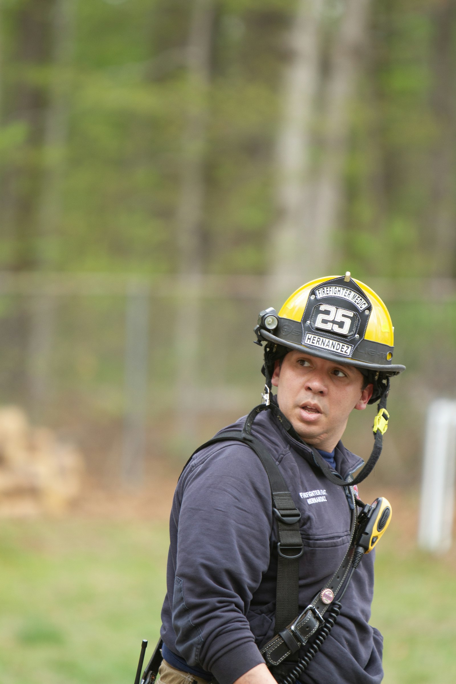 Firefighter using a portable radio